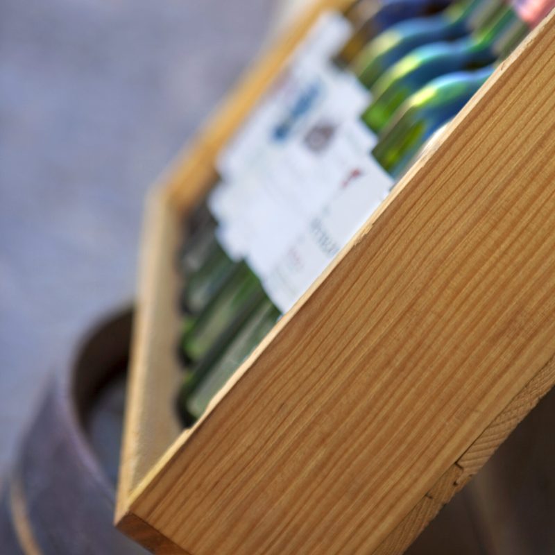 Bottles of red wine in a wooden box
